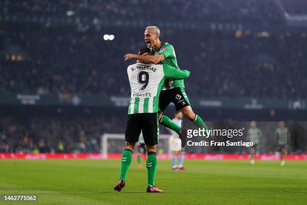 Sergio Canales of Real Betis celebrates with Borja Iglesias after scoring the team's second goal during the LaLiga Santander match between Real Betis...