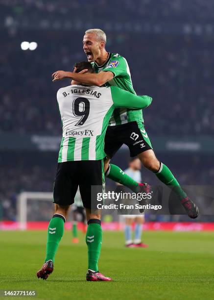 Sergio Canales of Real Betis celebrates with Borja Iglesias after scoring the team's second goal during the LaLiga Santander match between Real Betis...