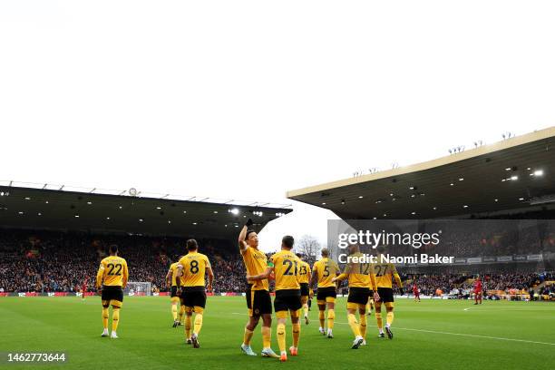 Hwang Hee-chan of Wolverhampton Wanderers celebrates their side's first goal, an own goal by Joel Matip of Liverpool during the Premier League match...