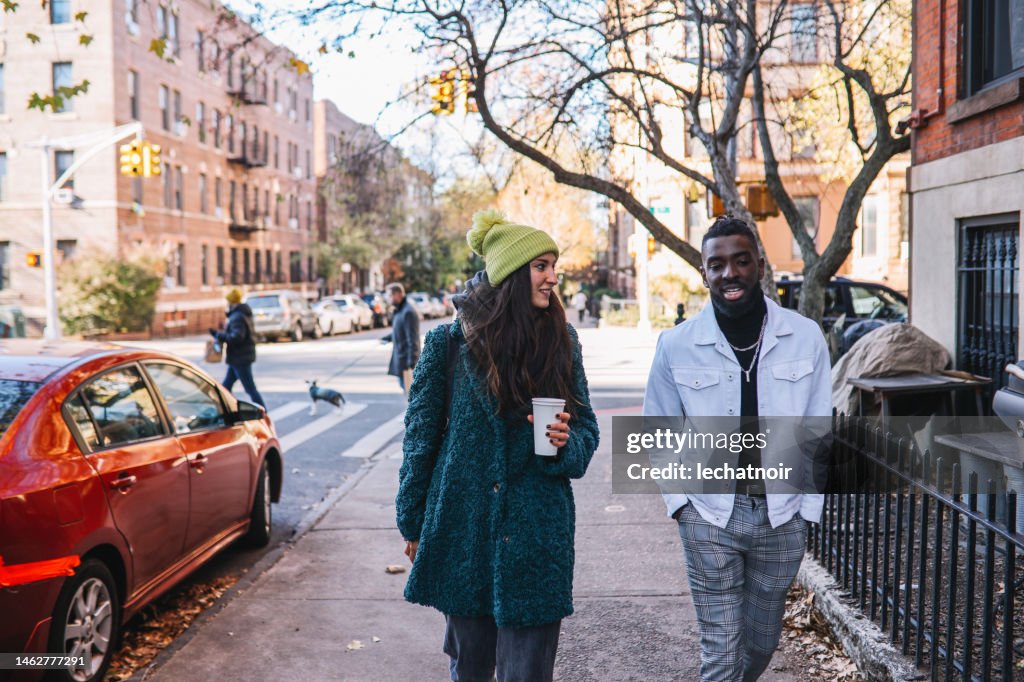 Friends talking on the street in Brooklyn, New York