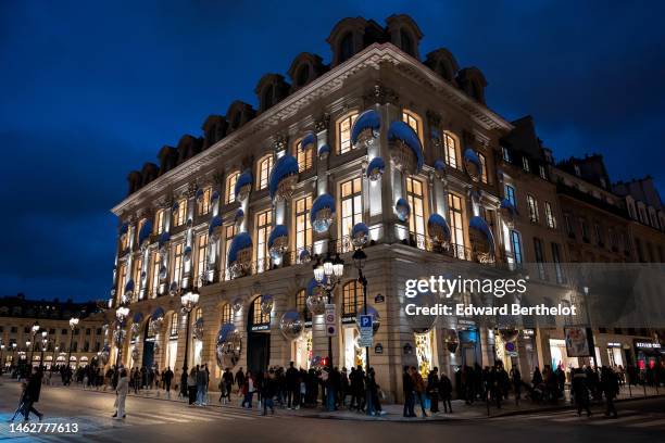The facade of the Louis Vuitton Store displays a Yayoi Kusama robot and mirrors at Place Vendome on February 04, 2023 in Paris, France.