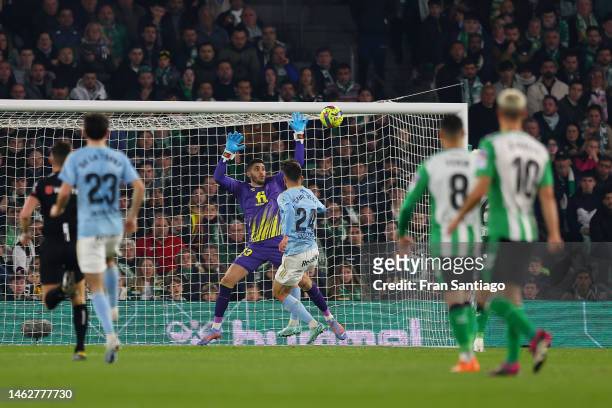 Gabri Veiga of RC Celta scores the team's second goal past Rui Silva of Real Betis during the LaLiga Santander match between Real Betis and RC Celta...