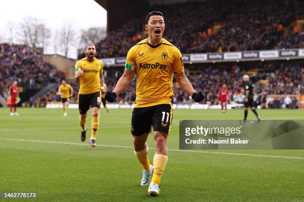 Hwang Hee-chan of Wolverhampton Wanderers celebrates their side's first goal, an own goal by Joel Matip of Liverpool during the Premier League match...