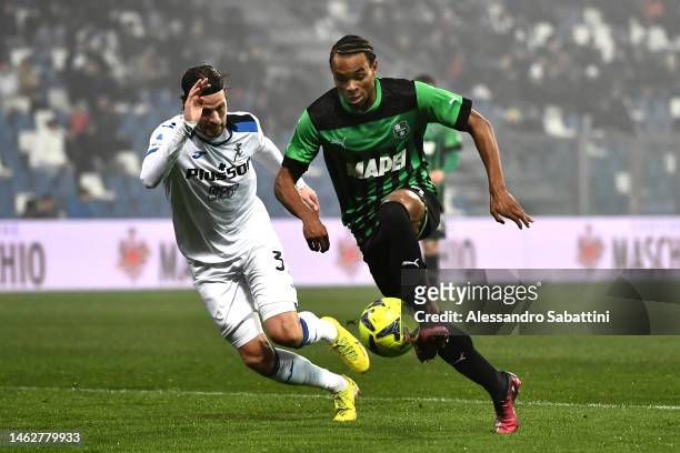 Armand Lauriente of US Sassuolo battles for possession with Hans Hateboer of Atalanta BC during the Serie A match between US Sassuolo and Atalanta BC...