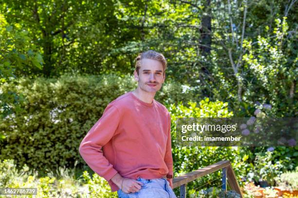 portrait of young man in the garden, background with copy space - grounds stock pictures, royalty-free photos & images
