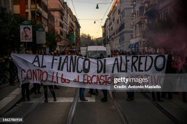 Demonstrators hold a banner reading “Al fianco di Alfredo” during a protest against the prison conditions of Alfredo Cospito on February 1, 2023 in...