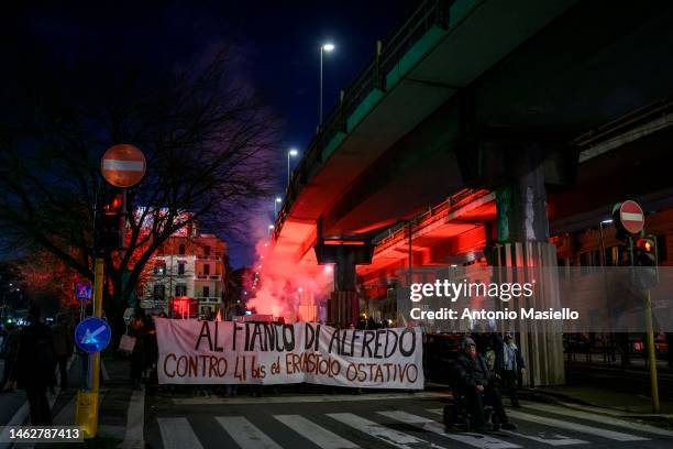 Demonstrators hold a banner reading “Al fianco di Alfredo” during a protest against the prison conditions of Alfredo Cospito on February 1, 2023 in...