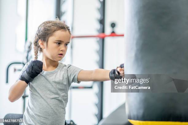 young girl boxing - determination kids stock pictures, royalty-free photos & images