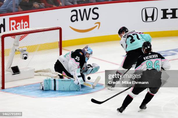 Linus Ullmark of the Boston Bruins makes a save against Andrei Svechnikov of the Carolina Hurricanes during the 2023 NHL All-Star Game between the...