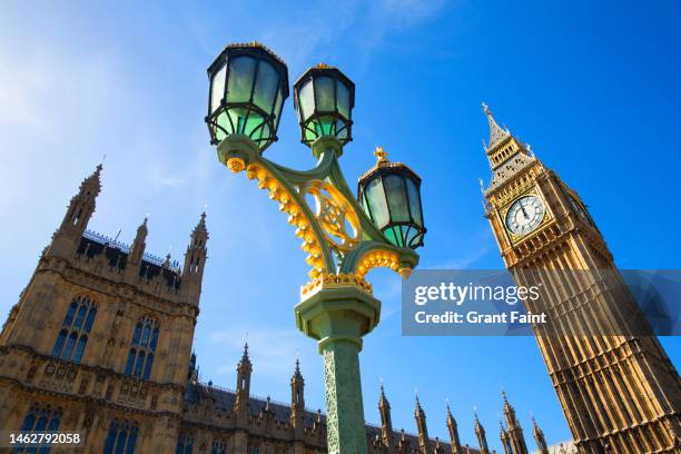 low angle of clock tower. - house of commons of the united kingdom stock-fotos und bilder