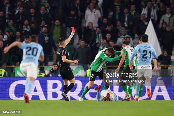 Luiz Felipe of Real Betis is shown a red card by Referee Carlos del Cerro during the LaLiga Santander match between Real Betis and RC Celta at...