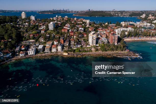 In an aerial view, competitors swim during the Cole Classic Ocean Swim from Shelly Beach to Manly Beach on February 05, 2023 in Manly, Australia.
