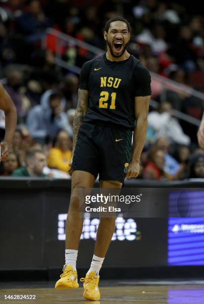 Dana Tate Jr. #21 of the Norfolk State Spartans celebrates after his three point shot in the second half against the Hampton Pirates during the...