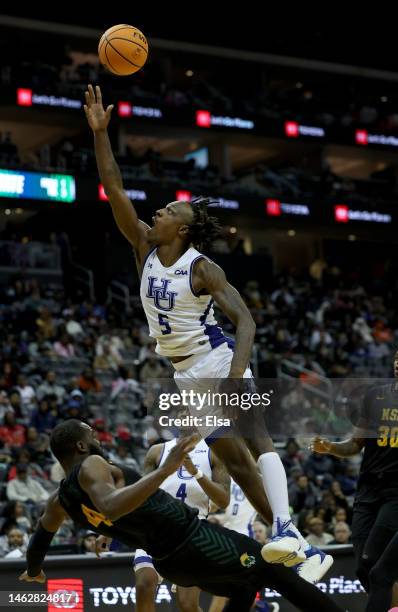 Jordan Nesbitt of the Hampton Pirates heads for the net as Joe Bryant Jr. #4 of the Norfolk State Spartans defends in the second half of the Invesco...