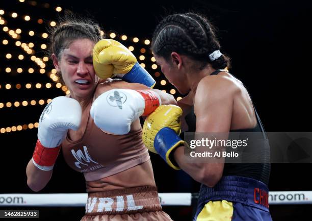 Ramla Ali punches Avril Mathie during their women's junior featherweight fight at The Hulu Theater at Madison Square Garden on February 04, 2023 in...