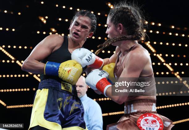 Avril Mathie punches Ramla Ali during their women's junior featherweight fight at The Hulu Theater at Madison Square Garden on February 04, 2023 in...