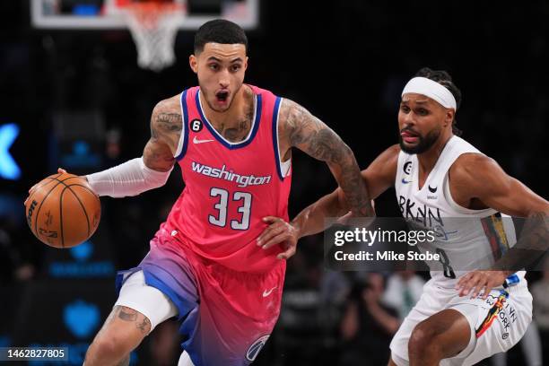 Kyle Kuzma of the Washington Wizards drives to the basket during the first half against Patty Mills of the Brooklyn Nets at Barclays Center on...