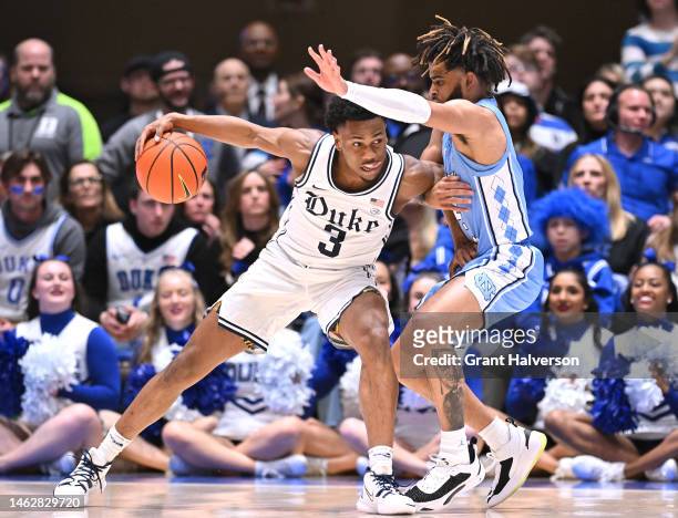 Jeremy Roach of the Duke Blue Devils drives to the basket against R.J. Davis of the North Carolina Tar Heels during the first half of their game at...