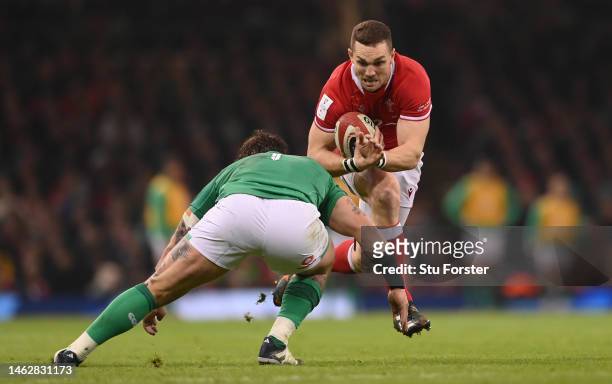 Wales player George North runs at Ireland prop Andrew Porter during the Six Nations Rugby match between Wales and Ireland at Principality Stadium on...