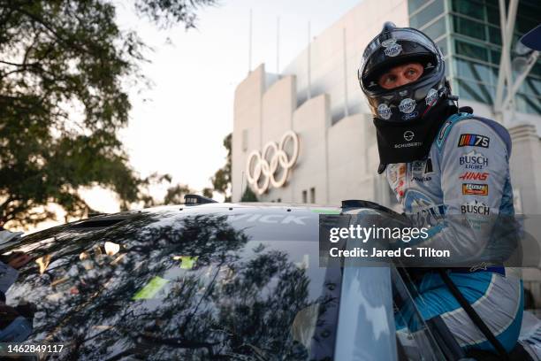 Kevin Harvick, driver of the Busch Light Ford, enters his car to qualify for the NASCAR Clash at the Coliseum at Los Angeles Coliseum on February 04,...