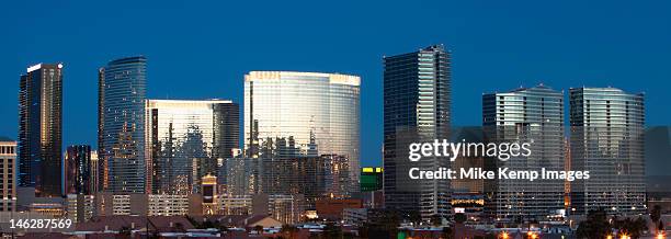 part of las vegas skyline in evening light - las vegas skyline night stock pictures, royalty-free photos & images