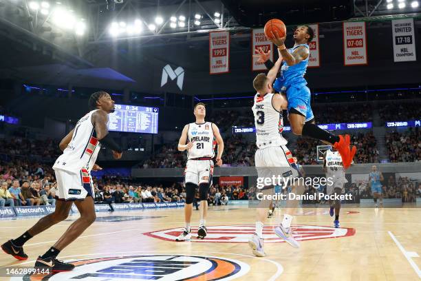 Rayjon Tucker of United drives to the basket under pressure from Anthony Drmic of the 36ers during the round 18 NBL match between Melbourne United...