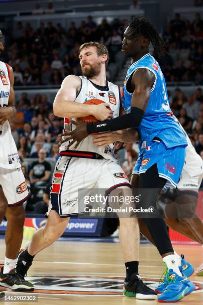 Mitch McCarron of the 36ers rebounds the ball against David Okwera of United during the round 18 NBL match between Melbourne United and Adelaide...