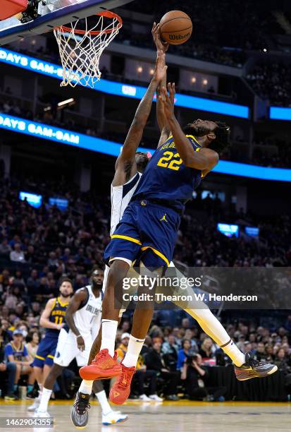 Andrew Wiggins of the Golden State Warriors goes up to shoot and gets fouled by Reggie Bullock of the Dallas Mavericks during the third quarter at...