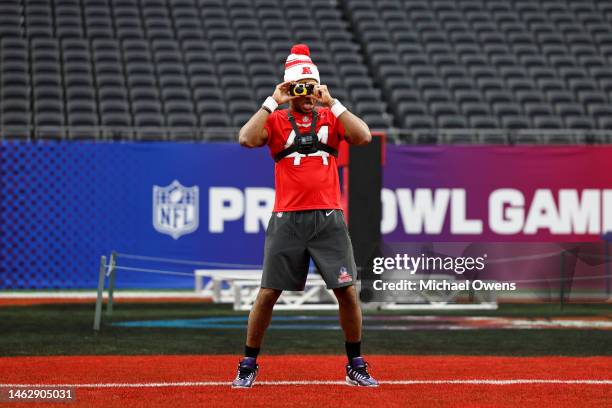 Cornerback Marlon Humphrey of the Baltimore Ravenss takes a photo with a disposable camera during a practice session prior to an NFL Pro Bowl...