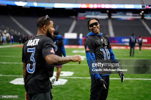 Strong safety Budda Baker of the Arizona Cardinals and NFC wide receiver Justin Jefferson of the Minnesota Vikings react during a practice session...