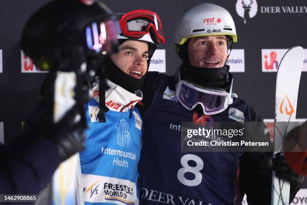 Mikael Kingsbury of Team Canada embraces Matt Graham of Team Australia after their championship match in the Men's Dual Moguls Finals on day three of...