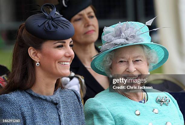 Catherine, Duchess of Cambridge and Queen Elizabeth II smile as they visit Vernon Park during a Diamond Jubilee visit to Nottingham on June 13, 2012...