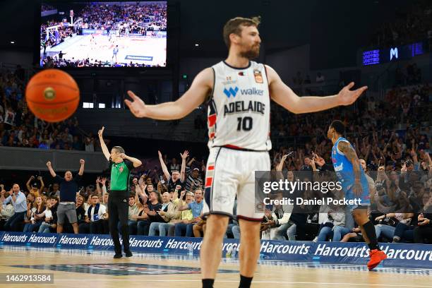 Rayjon Tucker of United celebrates a three pointer as Mitch McCarron of the 36ers gestures to the referee during the round 18 NBL match between...