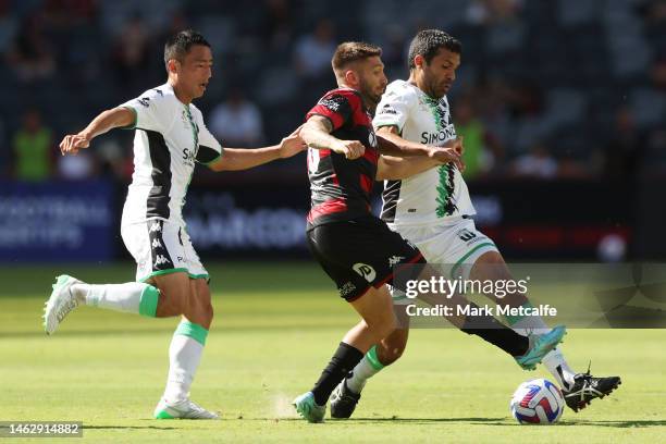 Brandon Borrello of the Wanderers is tackled by Nikolai Topor-Stanley of United during the round 15 A-League Men's match between Western Sydney...