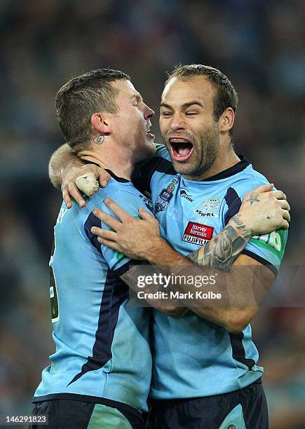 Todd Carney of the Blues celebrates with team mate Brett Stewart winning game two of the ARL State of Origin series between the New South Wales Blues...