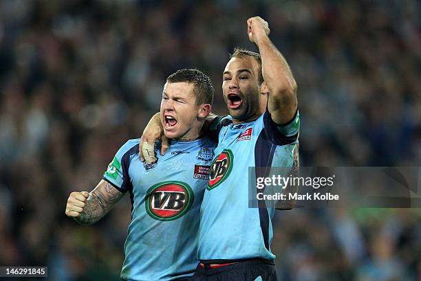 Todd Carney of the Blues celebrates with team mate Brett Stewart winning game two of the ARL State of Origin series between the New South Wales Blues...