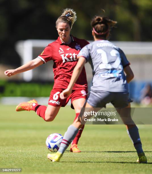 Jenna McCormick of Adelaide United passes past Shea Connors of the Brisbane Roar during the round 13 A-League Women's match between Adelaide United...