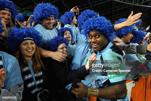 Akuila Uate of the Blues celebrates with fans after winning game two of the ARL State of Origin series between the New South Wales Blues and the...
