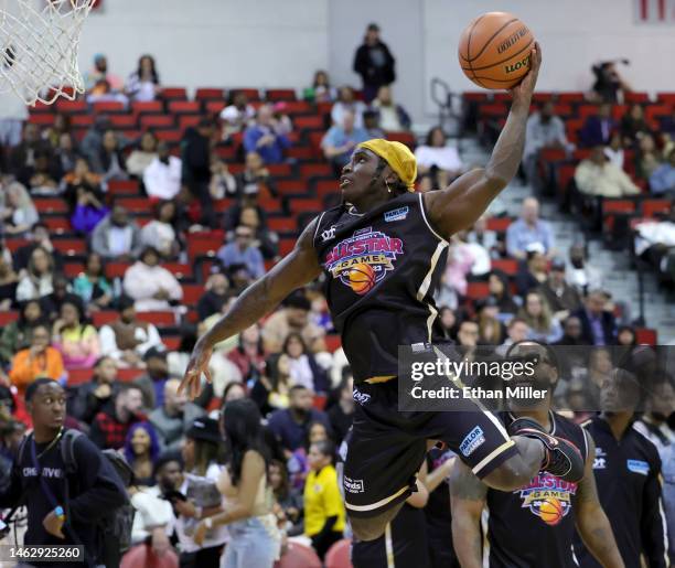 Player Tyreek Hill of the Miami Dolphins attempts to dunk as he warms up before the NFL Pro Bowl Weekend Celebrity All-Star Game 2023 benefiting the...