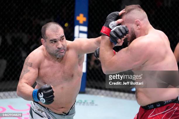 Blagoy Ivanov of Bulgaria punches Marcin Tybura of Poland in a heavyweight fight during the UFC Fight Night event at UFC APEX on February 04, 2023 in...