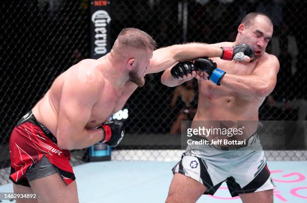 Marcin Tybura of Poland punches Blagoy Ivanov of Bulgaria in a heavyweight fight during the UFC Fight Night event at UFC APEX on February 04, 2023 in...