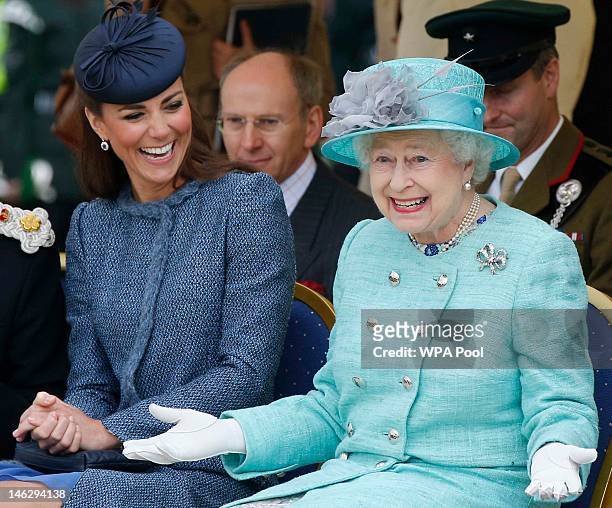Catherine, Duchess of Cambridge and Queen Elizabeth II watch part of a children's sports event while visiting Vernon Park during a Diamond Jubilee...
