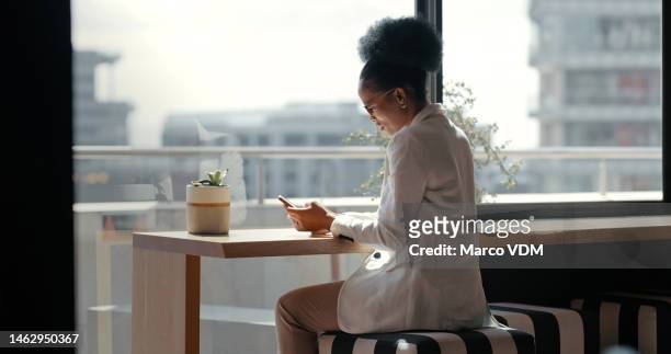 business, black woman and smartphone for typing, modern office and connection for social media. african american female employee, leader and executive with cellphone, chatting and search internet - financial technology stock pictures, royalty-free photos & images