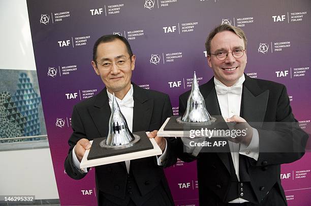 Shinya Yamanaka from Japan and Linus Torvalds from Finland pose after being awarded the 2012 Millennium Technology Prize in Helsinki on June 13,...