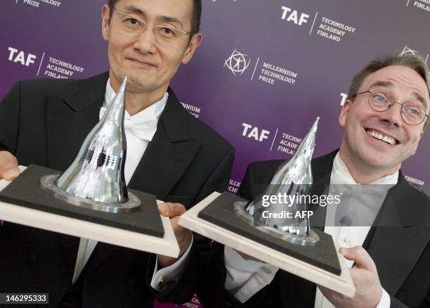 Shinya Yamanaka from Japan and Linus Torvalds from Finland pose after being awarded the 2012 Millennium Technology Prize in Helsinki on June 13,...