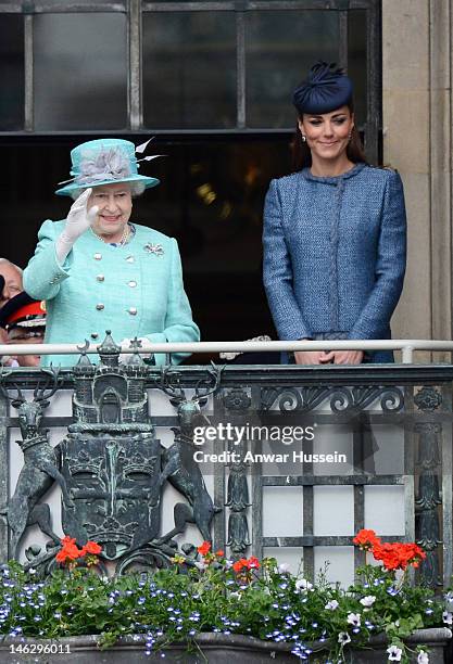 Queen Elizabeth ll waves beside Catherine, Duchess of Cambridge on the balcony of the Council House in the Market Square during a Diamond Jubilee...