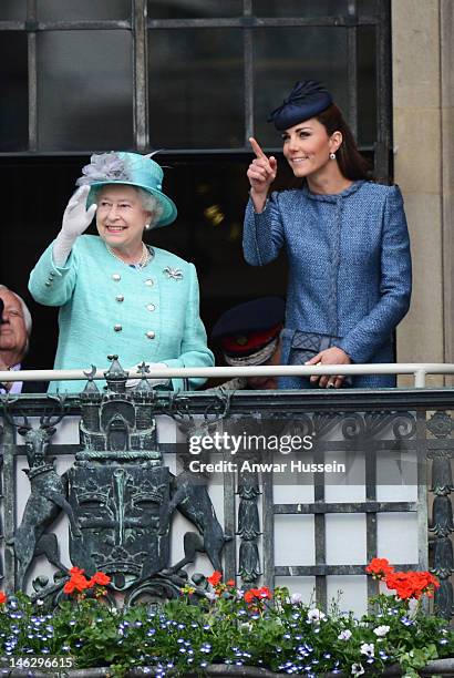 Queen Elizabeth ll and Catherine, Duchess of Cambridge stand on the balcony of the Council House in the Market Square during a Diamond Jubilee visit...