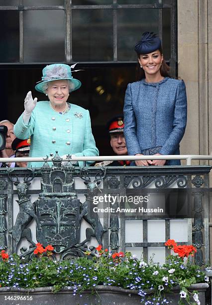 Queen Elizabeth ll and Catherine, Duchess of Cambridge stand on the balcony of the Council House in the Market Square during a Diamond Jubilee visit...