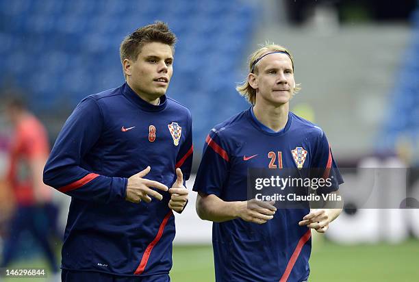 Ognjen Vukojevic and Domagoj Vida of Croatia during a UEFA EURO 2012 training session at the Municipal Stadium on June 13, 2012 in Poznan, Poland.