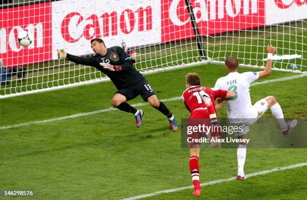 Nicklas Bendtner of Denmark beats Pepe of Portugal to head in their second goal during the UEFA EURO 2012 group B match between Denmark and Portugal...